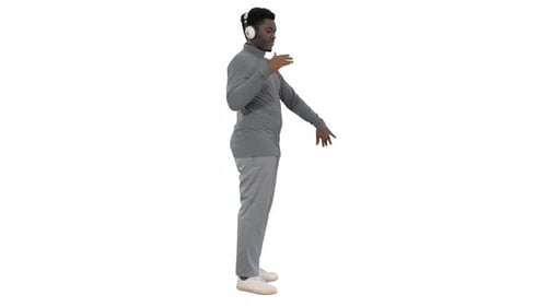 Man with Headphones Dancing on White Background