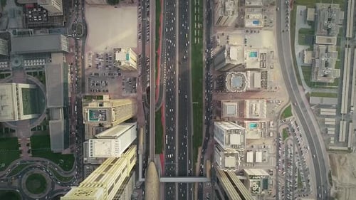 Aerial view of Dubai colourful skyscrapers, and long busy road ,UAE.