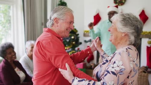 Senior Couple Dancing at Festive Christmas Party