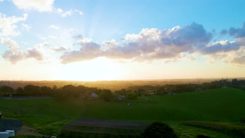 Aerial View of Green Hills at Sunrise