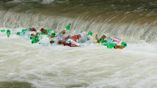 Pollution By Plastic Garbage Bottles in the River