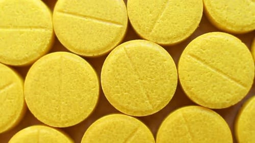 Close up of Yellow Medicine Pills