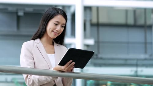 Business Woman Using Tablet in Modern Office Building