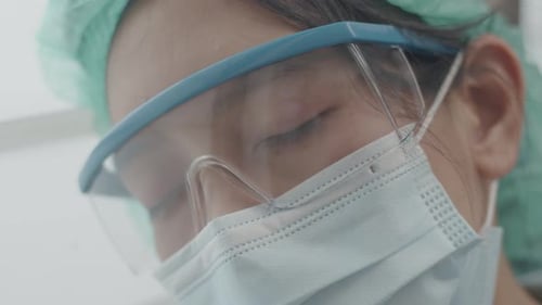 Close-up portrait female nurse is tired from work Due to the severe covid-19 pandemic situation.