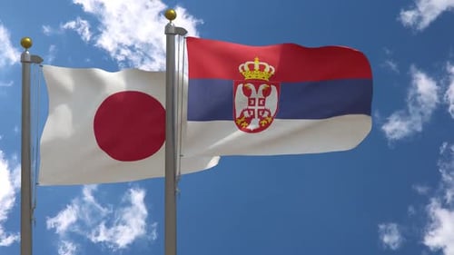 Flags of Japan and Serbia Waving in the Wind