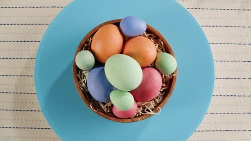 Colorful Easter Eggs in Wooden Bowl