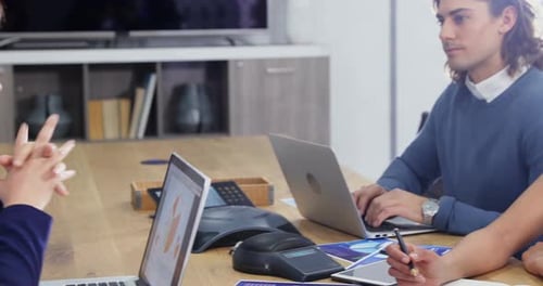 Diverse Team Collaborating in Modern Office Meeting