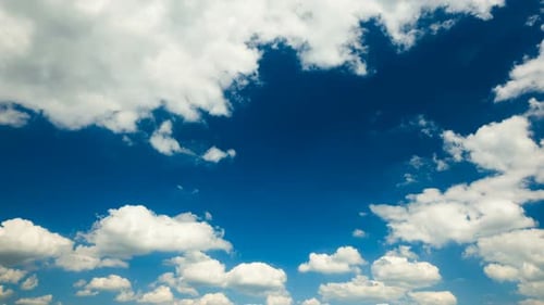 Dynamic Clouds Moving Across a Blue Sky