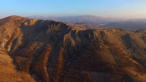 Aerial View of Mountain Range at Sunrise