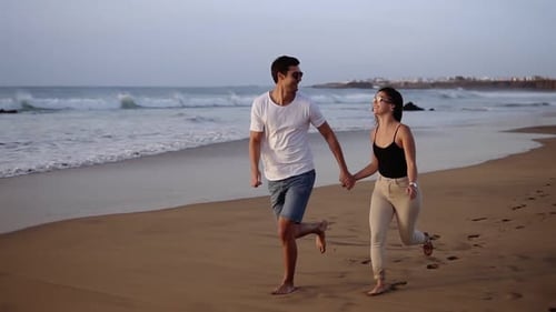 Couple Enjoy Summer Vacation on the Large Beach Enjoy Life and Running in Scenery Slow Motion Video