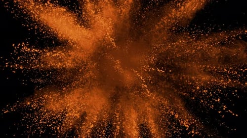 Orange powder exploding on black background in super slow motion, shot with Phantom Flex 4K