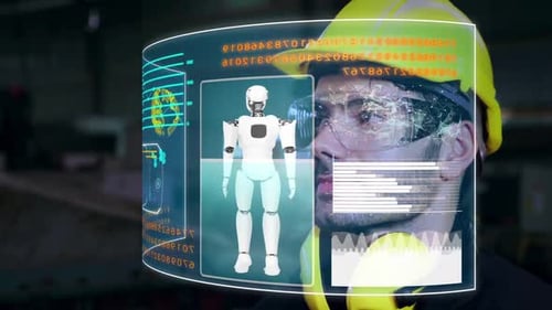 Un ouvrier d'usine utilise un futur dispositif d'écran holographique pour contrôler la fabrication