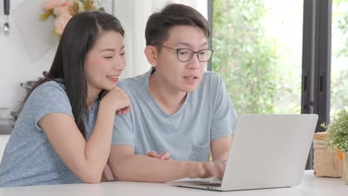Couple using Laptop Together at Home