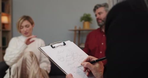 Couple in Therapy Session Talking with Therapist