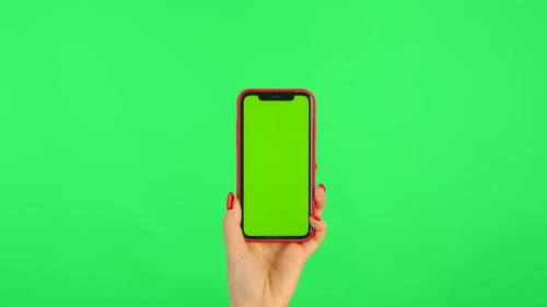 Woman Holds Mobile Phone with Workspace Mock Up Screen on Green Background
