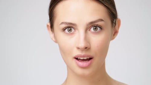 Beautiful Young Woman Expressing Emotions in Close-Up