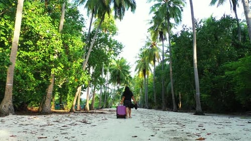 Happy lady on vacation spending quality time at the beach on paradise white sand and blue