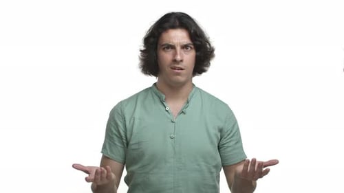 Studio Shot of Handsome Hispanic Man Looking Confused Cant Understand Something Strange Raising