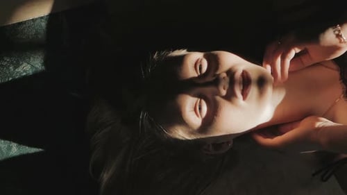 Beautiful Woman Lying in Sunlight