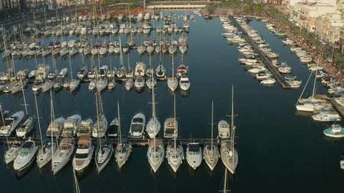 Sailboats in the Harbour of Small Town on Malta Island, Aerial Tilt Down View