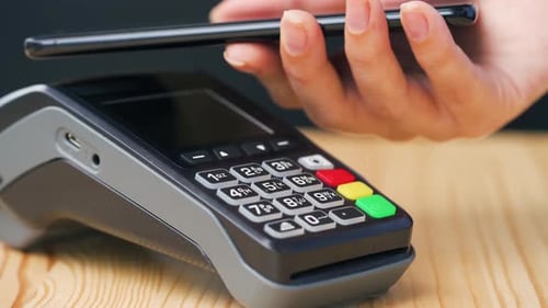 Contactless Payment with Smartphone. Wireless Payment Concept. Close-up, Woman Using Smartphone