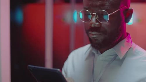 African American Data Center Worker Using Digital Tablet