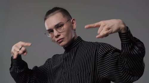 Young Adult Posing with Hand Gestures