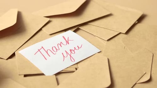 Thank You Card on a Pile of Envelopes