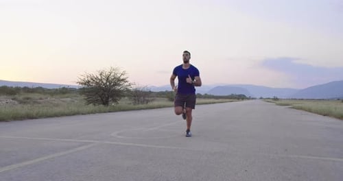 Runner Sprinting During Outdoors Training for Marathon Run
