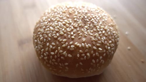Sesame Seed Bun Close Up on Wood Surface