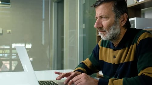 Old Man Working On Laptop
