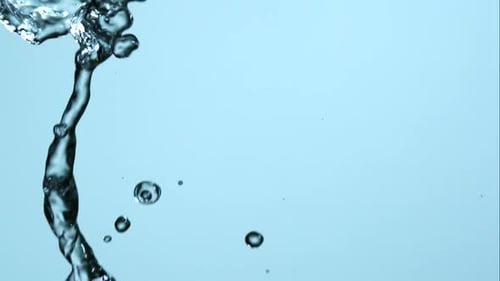 Water Pouring and Flowing Dynamically on Blue Background