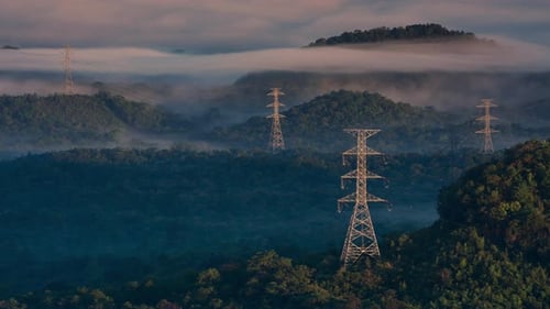 Aerial view high voltage power transmission towers.