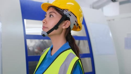 Close up factory worker woman control machine working in workplace area