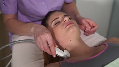 Woman Receiving Facial Treatment in a Spa