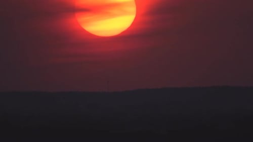 Fiery Sunset Over a Dark Horizon