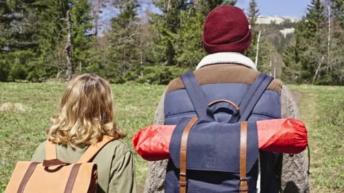 Loving Couple Walking through Woods