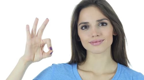 Young Brunette Woman Showing Ok Hand Gesture
