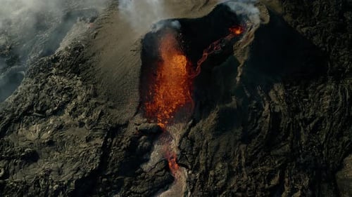Spectacular aerial top down of lava spewing from an active erupting volcano during daytime.