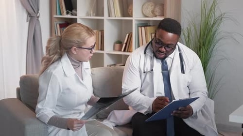 Medical Professionals Reviewing X-Ray and Clipboard