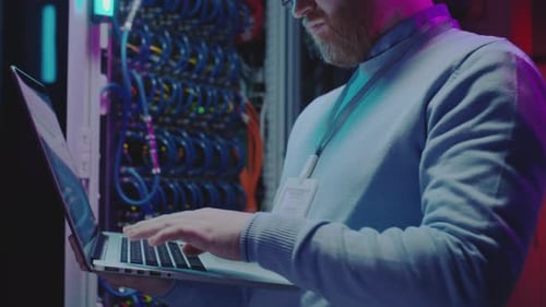 Data Center Worker Using Laptop
