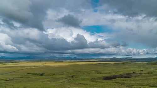 Clouds Move Over the Mountains and Plain in Iceland