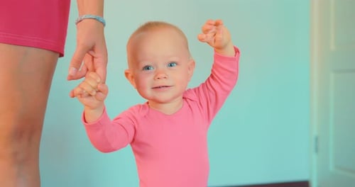 Happy Infant Learning to Walk with Assistance