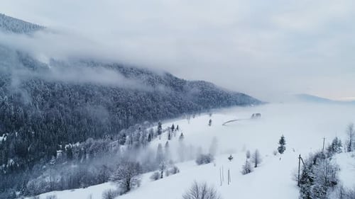 Aerial View in Foggy Sunset Winter Mountain