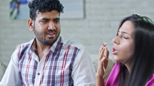 Couple Arguing During Conversation in Living Room
