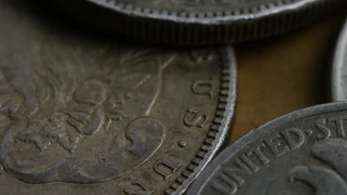 Macro Footage of a Pile of Vintage Silver Dollars
