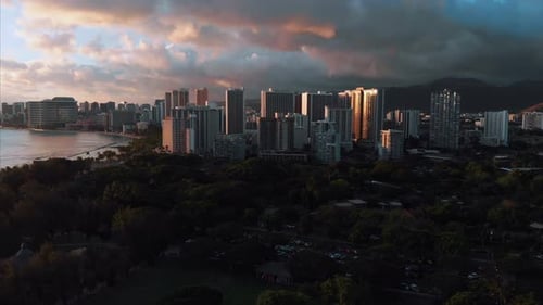 Aerial drone footage of Honolulu, Hawaii.
Beautiful real estate, buildings in the city.
Palm trees
