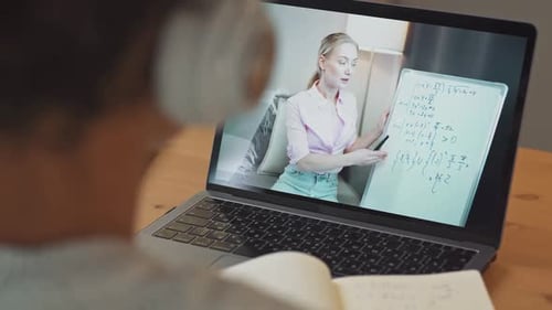 Student Watches Online Math Lesson at Home