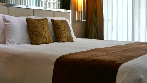 Clean, Comforting Bed in Bright Hotel Room