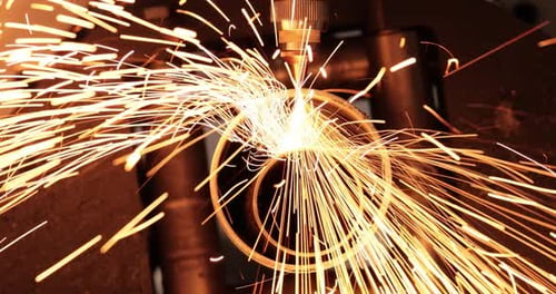 Metal Cutting Machine Sparks in an Industrial Setting